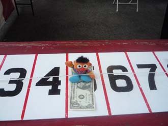 Ernie trying to win $$ on the money wheel